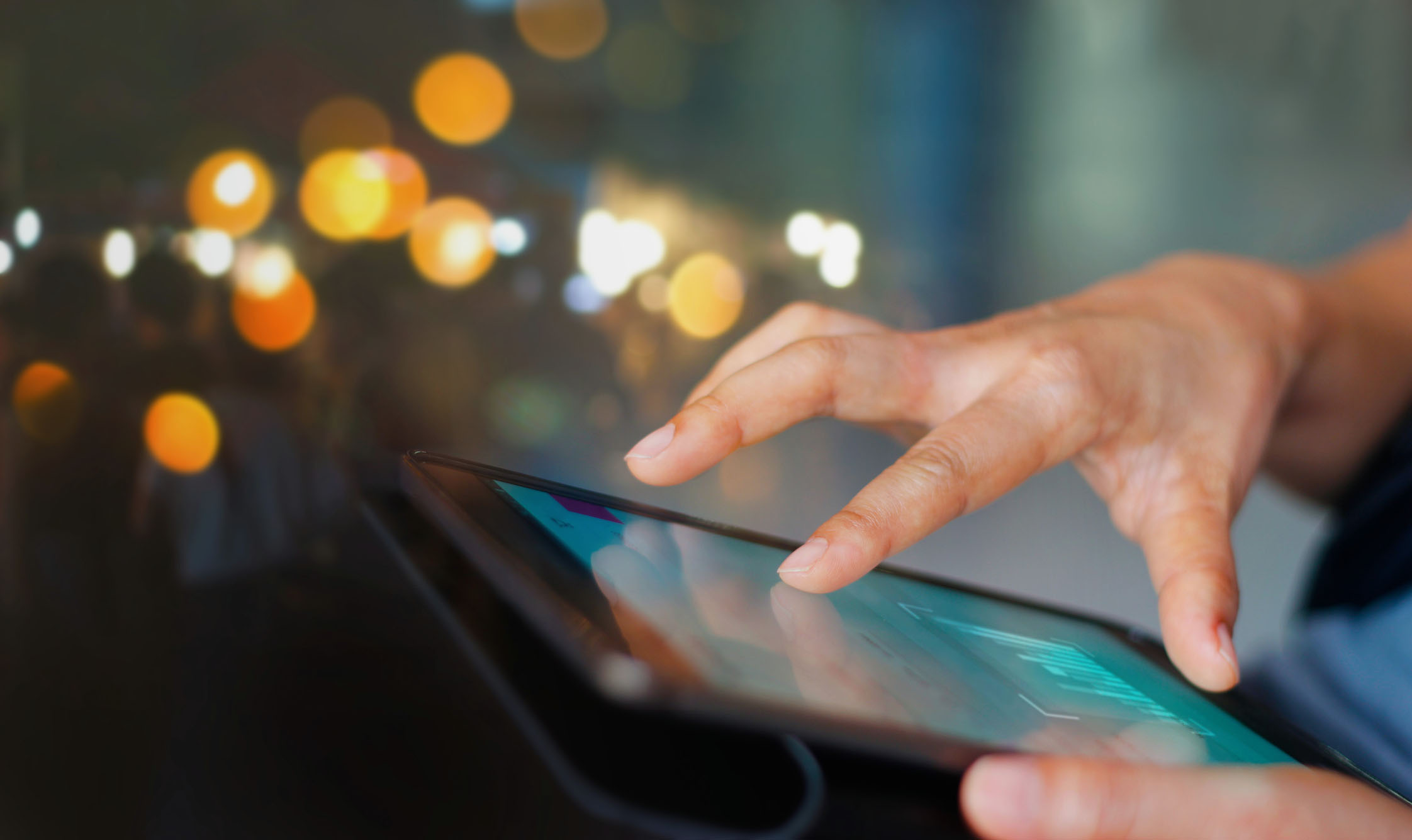 Businessman using tablet at night time